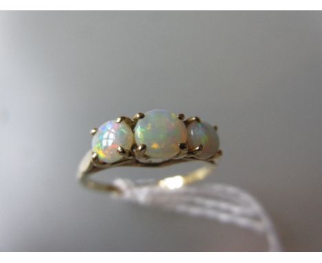 18ct Yellow gold three stone opal ring