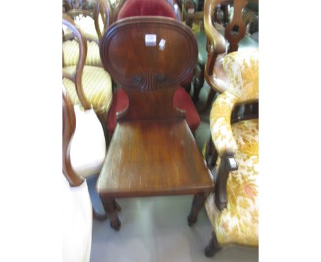 Early 19th Century mahogany hall chair, with an oval moulded back, panel seat and turned front supports