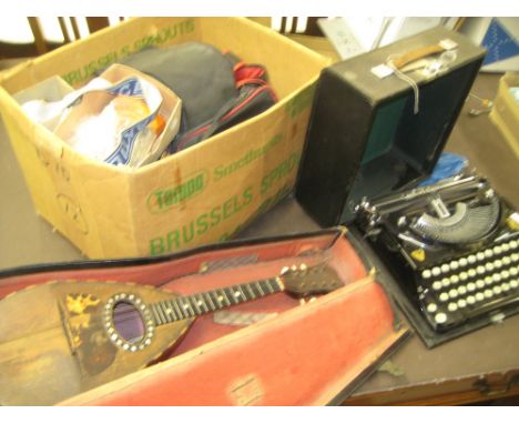 Quantity of various cigarette lighters, quantity of gilt brass pulls, quantity of various cameras, a typewriter and a mandoli