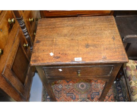 Small reproduction oak side table with single drawer on square cut supports