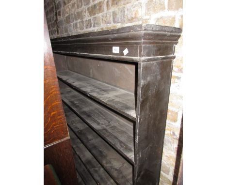 Stained pine six shelf open bookcase with plinth base