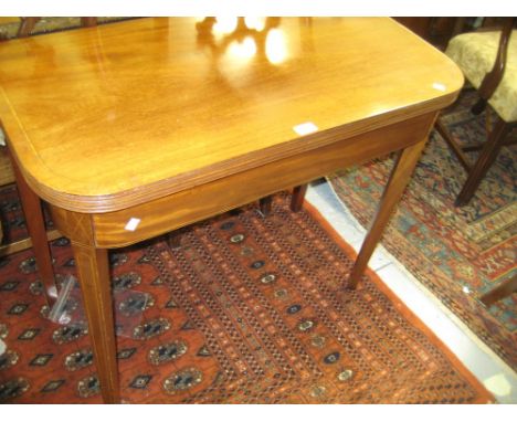 George III mahogany and line inlaid fold-over card table on square tapering supports