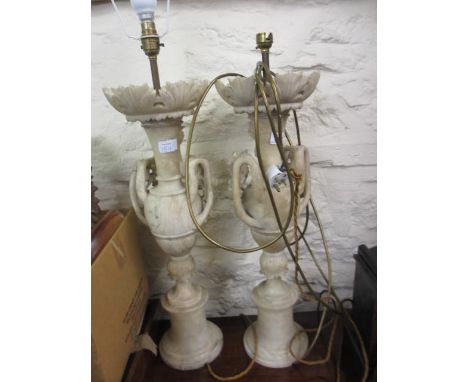 Pair of 19th Century carved alabaster table lamps, the baluster form bodies and socle bases with grape vine design side handl