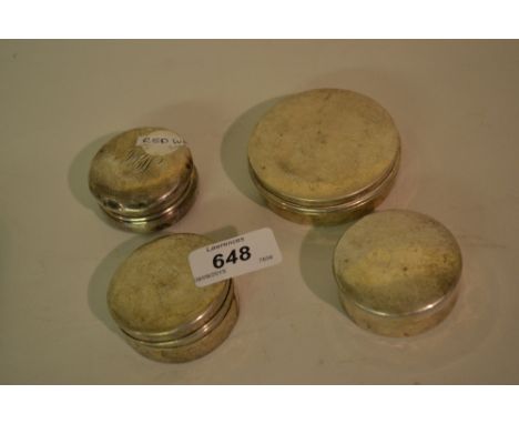 Four various circular silver trinket boxes