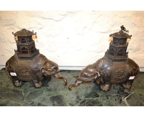 Pair of large 19th Century Chinese dark patinated bronzed alloy elephant censers with pagoda covers with multiple character s