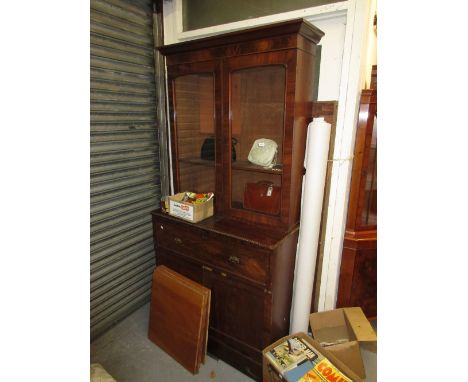 Victorian mahogany secretaire bookcase, the moulded cornice above two arched glazed doors, the base with a secretaire drawer 