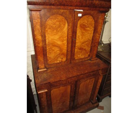 19th Century continental figured walnut side cabinet, the moulded cornice above a shaped concealed drawer with two arched pan