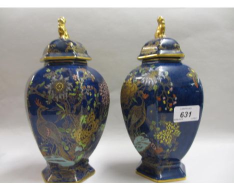 Pair of Carltonware (W & R mark) hexagonal baluster form vases with covers, decorated with exotic birds and foliage in gilt a