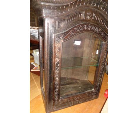 Unusual arch topped carved oak wall cabinet with glass door and sides