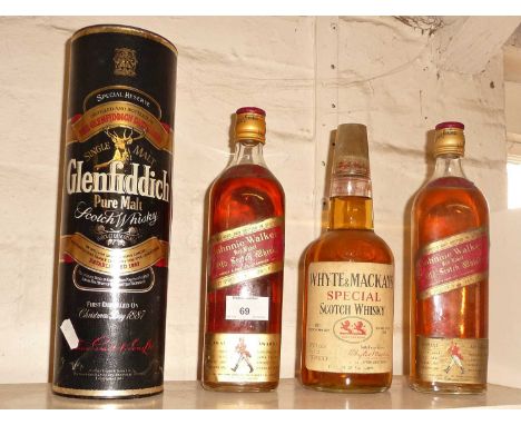 Two bottles of Johnny Walker whisky, a White &amp; Mackays Special whisky and a cased bottle of Glenfiddich