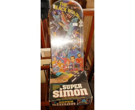 A vintage boxed MB Electronics Super Simon game and a 1970s Marx Toys "The Black Hole" (Disney film) pinball game