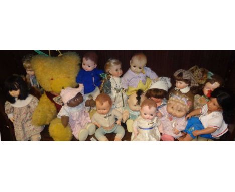 Collection of assorted dolls and a large teddy bear