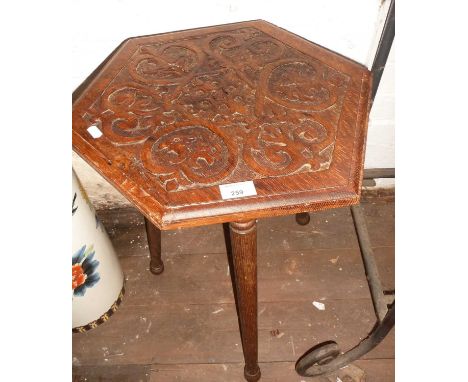 Edwardian carved oak occasional table on tripod legs