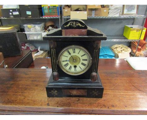 An Edwardian mantel clock with Roman numerals, 27cm tall