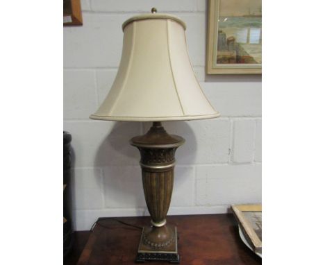 A column form table lamp with cream shade, 87cm tall