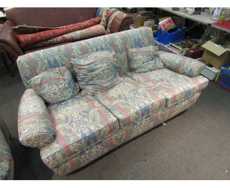 A 20th Century three seater sofa with floral upholstery