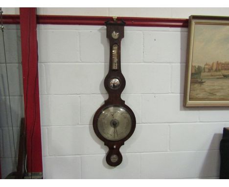 A mid to late 19th Century mahogany five dial wheel barometer