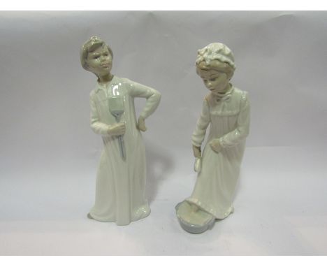 Two Nao figures girl &amp; boy in night attire, 29cm tall