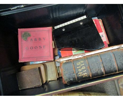 A tin trunk containing a quantity of assorted children's puzzles and games to include Gobby Goose, Popeye, puppet, piano and 