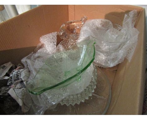 Two boxes containing assorted glassware and china to include glass bowls, commemorative cups, serving plates, etc