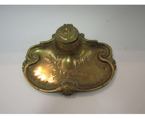 A brass floral design inkwell with ceramic bowl