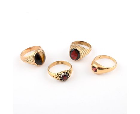 the oval-shaped tiger's eye is set in 9ct gold, 8.4 grams, size T, together with an oval-shaped garnet and 9ct gold ring, 6.8