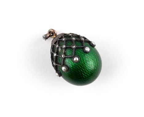 the green guilloche enamel egg pendant is mounted with rose-cut diamonds and small pearls, with further rose-cut diamonds set