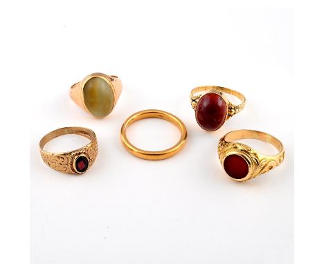 mounted with an oval-shaped cabochon garnet in 18ct gold, 4.6 grams, size T, together with a cornelian and 18ct gold ring, 10