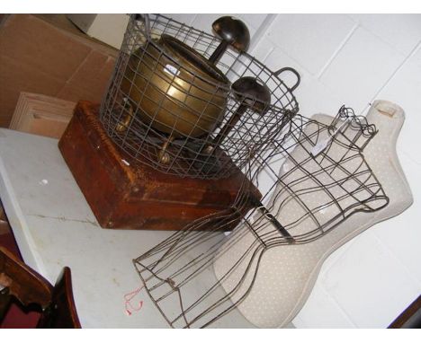Two seamstresses dressing mannequins, an old wire basket, a vintage suitcase, etc. 