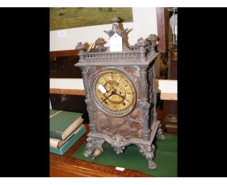 A decorative metal chiming mantel clock - 35cms high