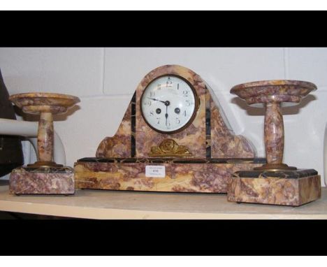 An Art Deco three piece French mantel clock 