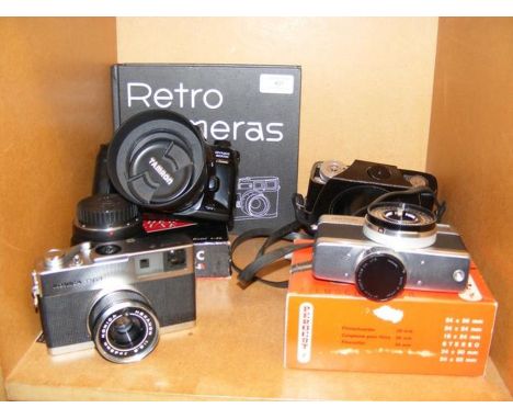 A number of vintage cameras, including Konica 261, a Minolta Dynax 600 Si and Fujica Rapid D1, together with 'Retro Cameras' 