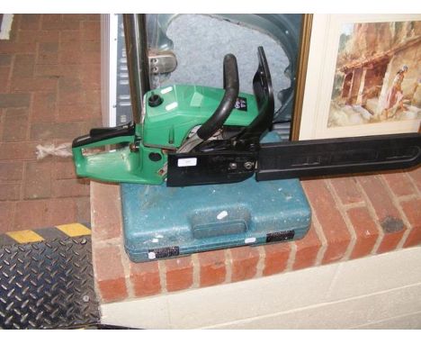A petrol powered chainsaw, together with Makita drill 