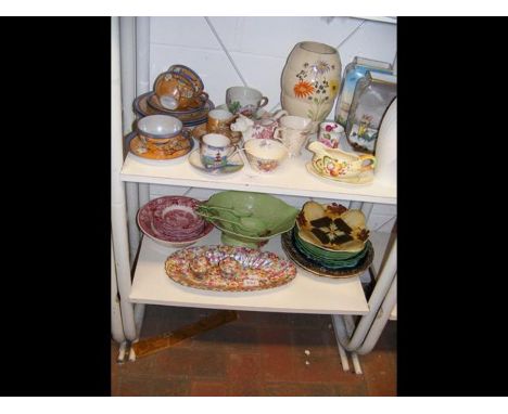 A Sylvac vase, a Carlton Ware leaf bowl and salad servers, together with other collectable china - on two shelves 