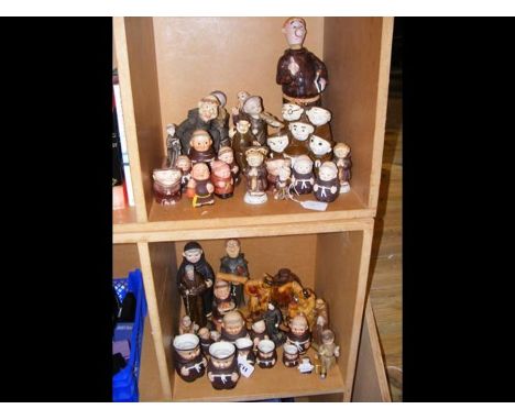 A medley of monk themed ornaments and jugs some by Goebel - in two compartments