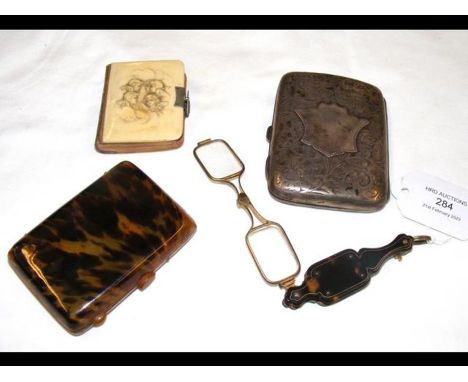Lorgnettes, a silver cigarette case, etc. 