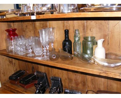 A medley of vintage glass feeding bottles and glassware, including some Isle of Wight 