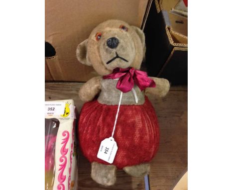 c1950s English teddy bear with jingle bells and red stuffed 'skirt' original blue top now faded - possibly Chiltern. Approx. 