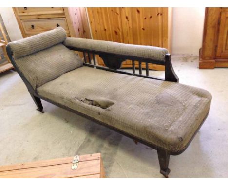 A vintage Chaise Lounge in need of restoration.