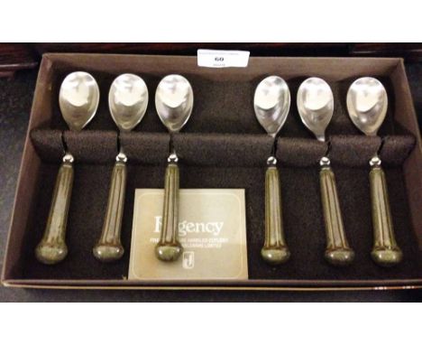 A boxed set of Denby Regency teaspoons with ceramic green handles.