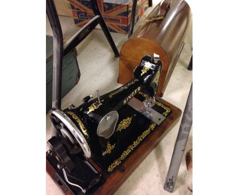 A vintage Singer sewing machine in case