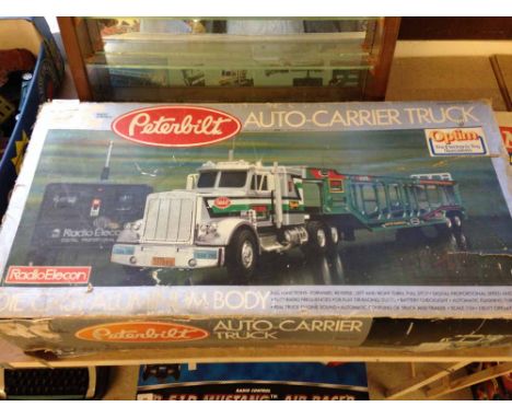 A boxed radio controlled Peterbilt auto-carrier truck 1:24 scale