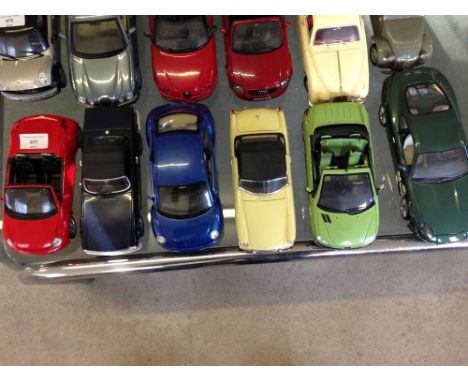 6 unboxed 1:18 scale cars to include a Corgi MGB