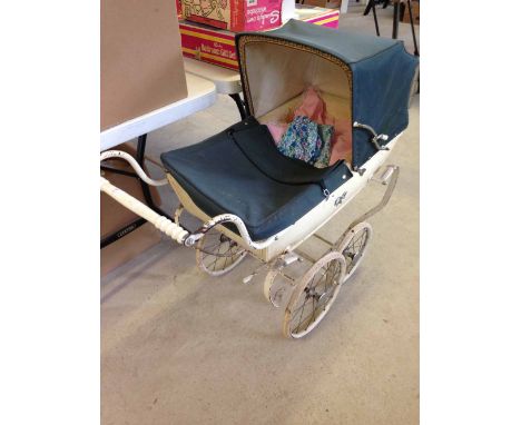 Vintage Silver Cross dolls pram.