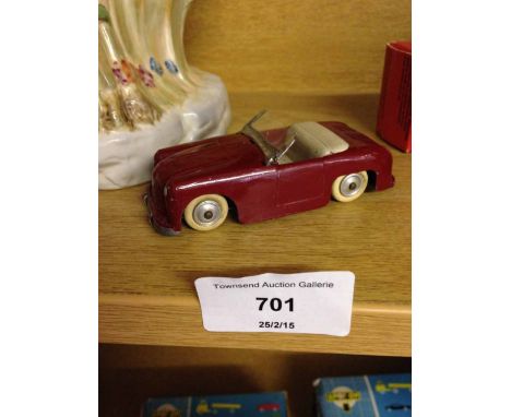 An unboxed French CIJ R de Rovin diecast car in claret paint and white rubber tyres