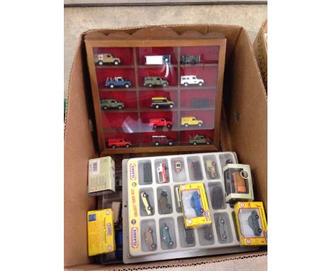 A small wooden display case containing 1:76 scale Land Rovers, a Classix display case with vehicles, a tray of cars with 5 bo