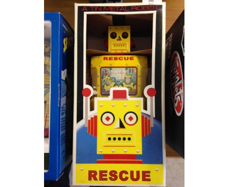 A boxed tinplate R-1 Rescue Robot by Rocket USA 12" tall.