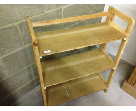 A wooden display shelf unit.