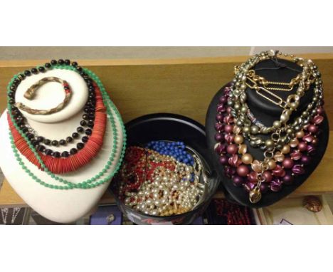 A quantity of costume jewellery necklaces to include vintage examples and faux pearls.