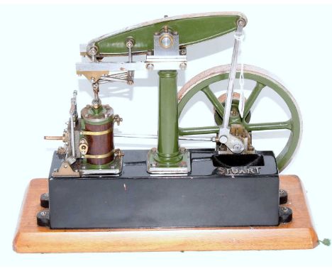 A Stuart Turner stationery beam engine comprising of green and black body with wooden clad vertical single cylinder with stea